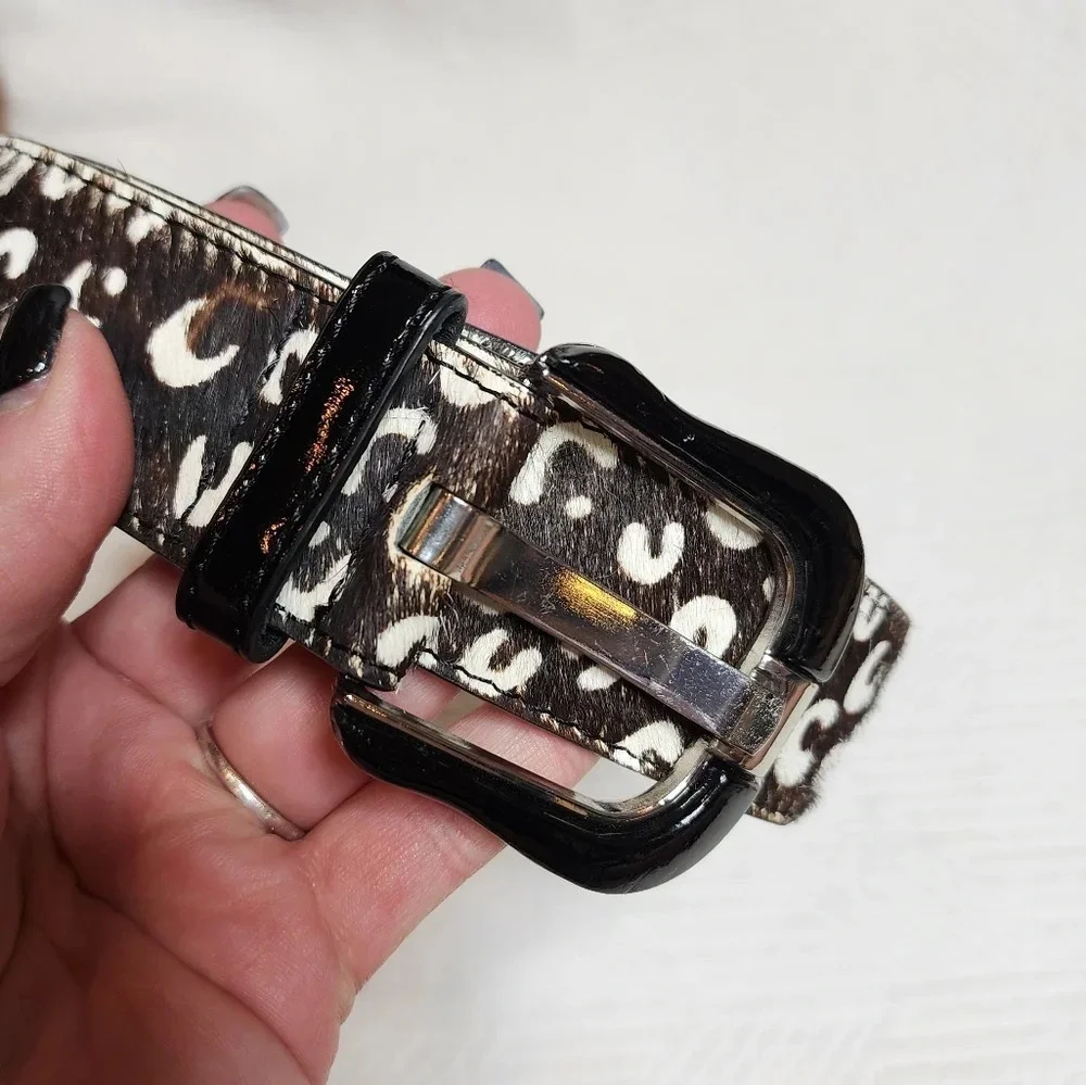 100% calf hair leather‎ dark brown, white spotted belt.